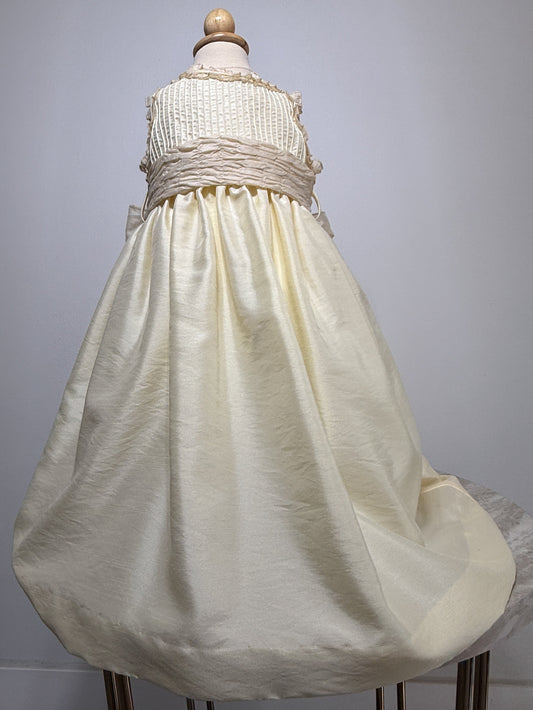 White dress on a mannequin against a gray background